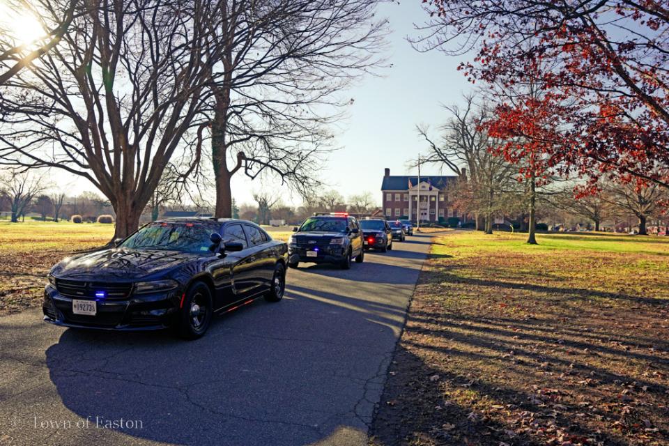 Easton Police Department, Oxford Police Department, and Talbot County Sheriff's Office squad cars depart with lights and sirens from the Elks Lodge #1622 on Dutchman's Lane in Easton to begin their shopping.