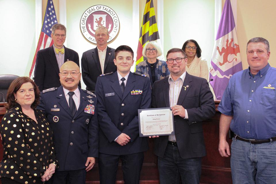 From left: Horner's Mother, Lt. Col. Archie DeJesus, Philip Horner, Council Member Stepp, Horner's father.